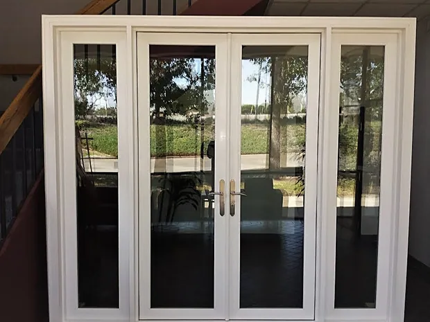 French doors with sidelites viewed from an interior stairwell