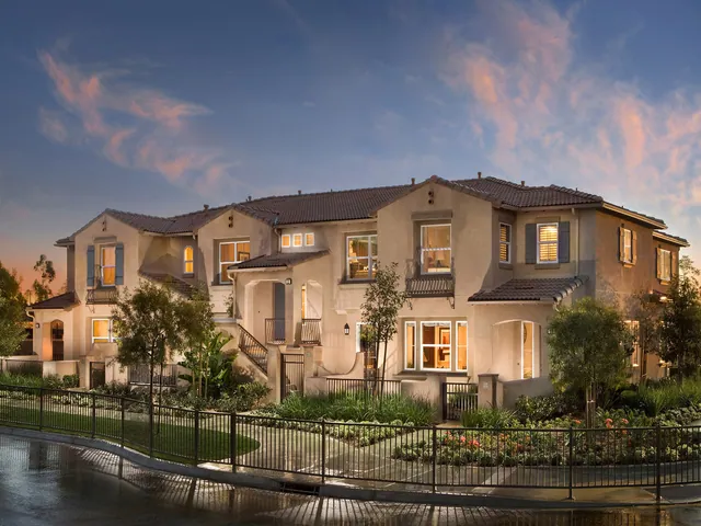 Two-storey home at dusk, windows replaced throughout