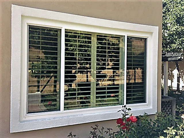 Slider window with plantation shutters