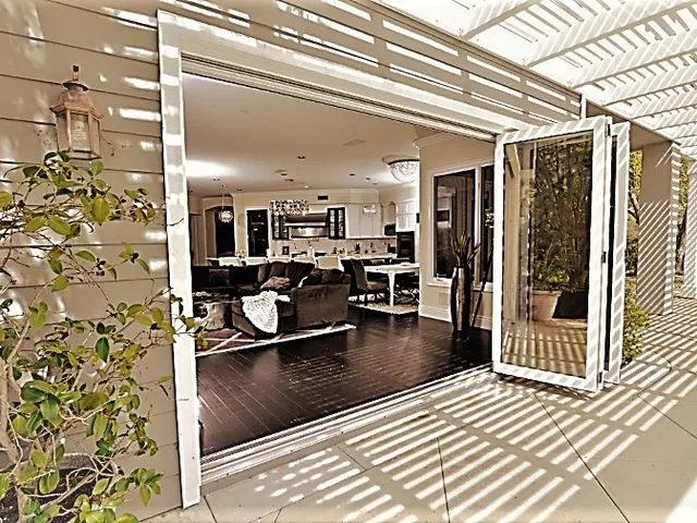 Folding glass doors seen from the courtyard side