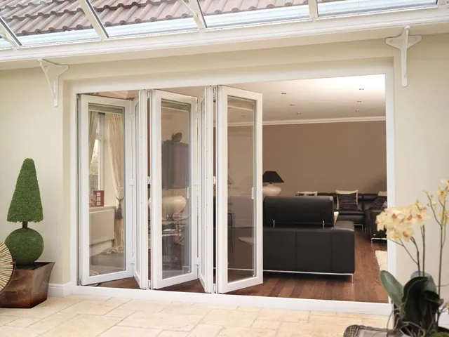 Bi-fold doors folded to one side of a living space