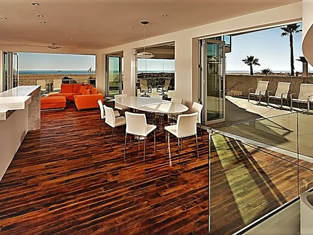 Multi-slide wall opening a dining room onto a deck