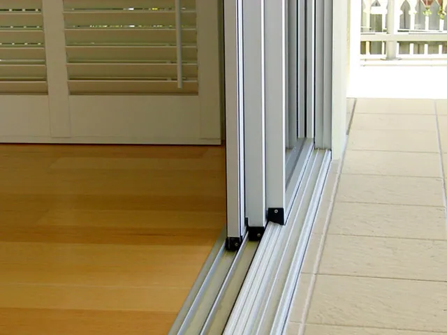 Sill and track detail on an installed sliding system