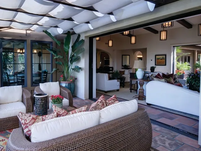 Patio room with folding doors under a pergola