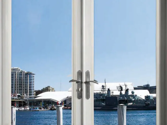 White French door pair with a waterfront view