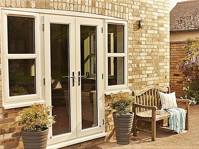White French swing doors on a brick elevation