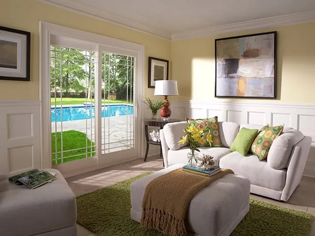 Living room window looking onto a pool