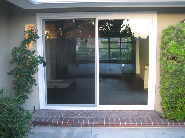 Patio slider installed in a brick rear elevation
