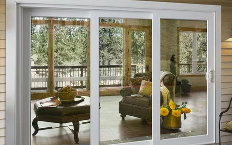 White vinyl horizontal slider window on a painted deck wall