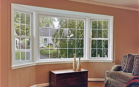 Living room picture window with colonial grids and a white vinyl frame