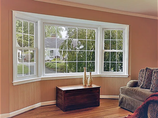 Living room picture window with colonial grids and a white vinyl frame